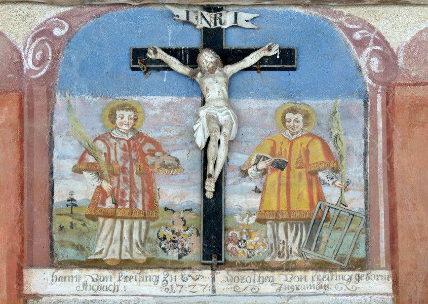 Crucifix on Saint John the Baptist church in Freins