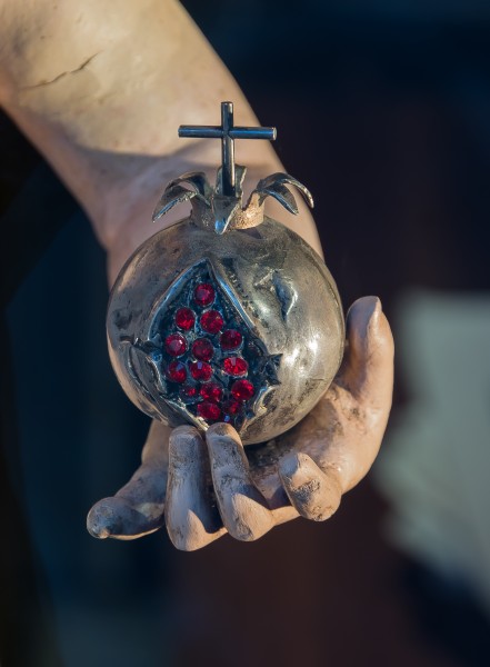 Pomegranate in hand of Jesus, Granada, Spain