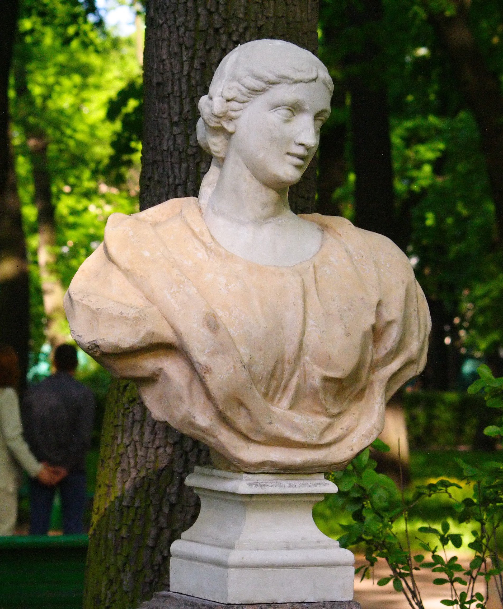 Woman in pink, summer garden (cropped)