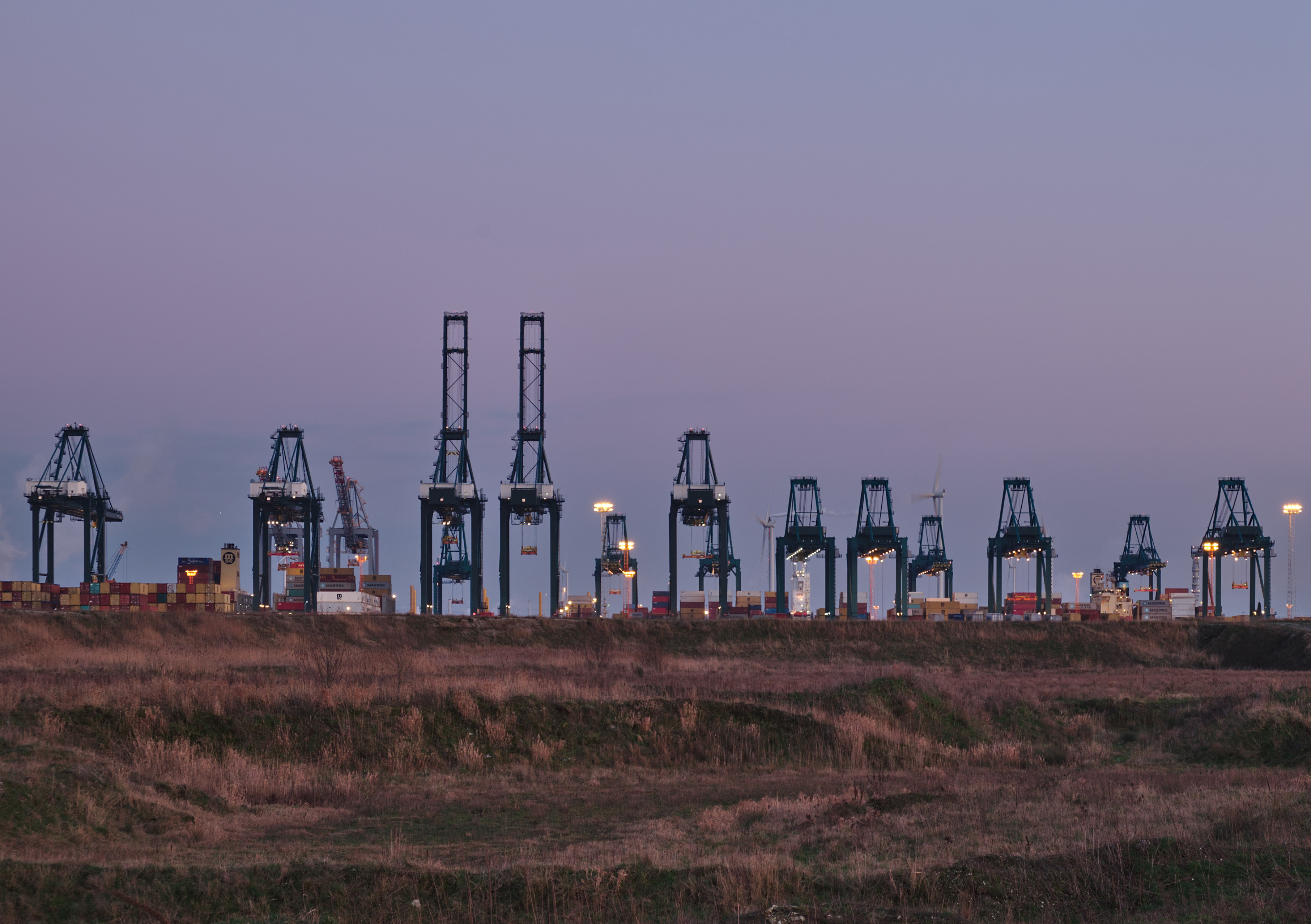 Container cranes at the MPET- MSC PSA European Terminal in Port of Antwerp (Kieldrecht, Belgium) during the sunset civil twilight (DSCF3919)