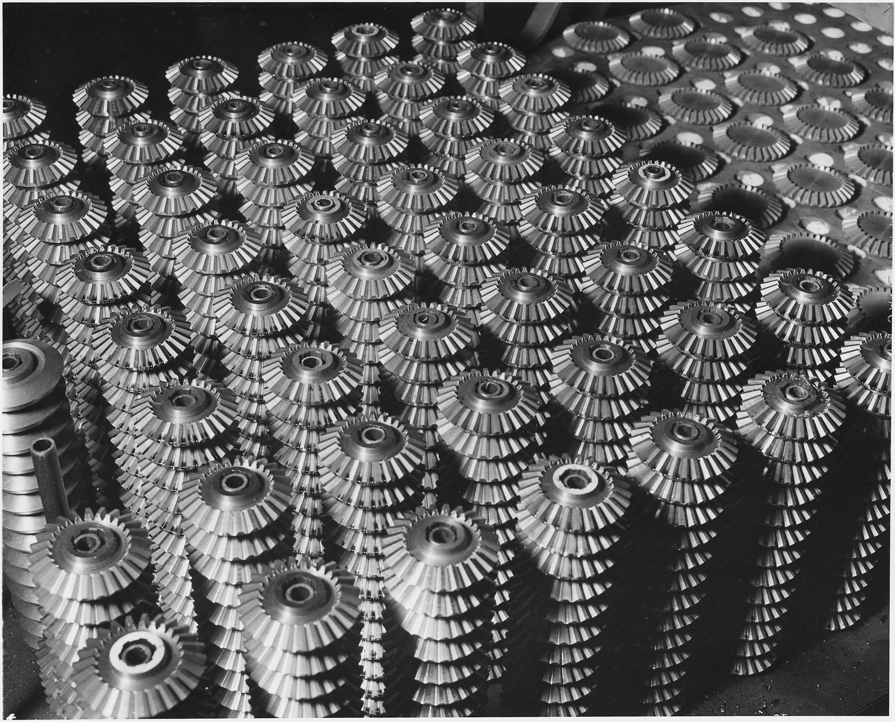 Hundreds of these precision cut gears roll off specially designed gear-cutters daily in the Bors plant of a large... - NARA - 196208