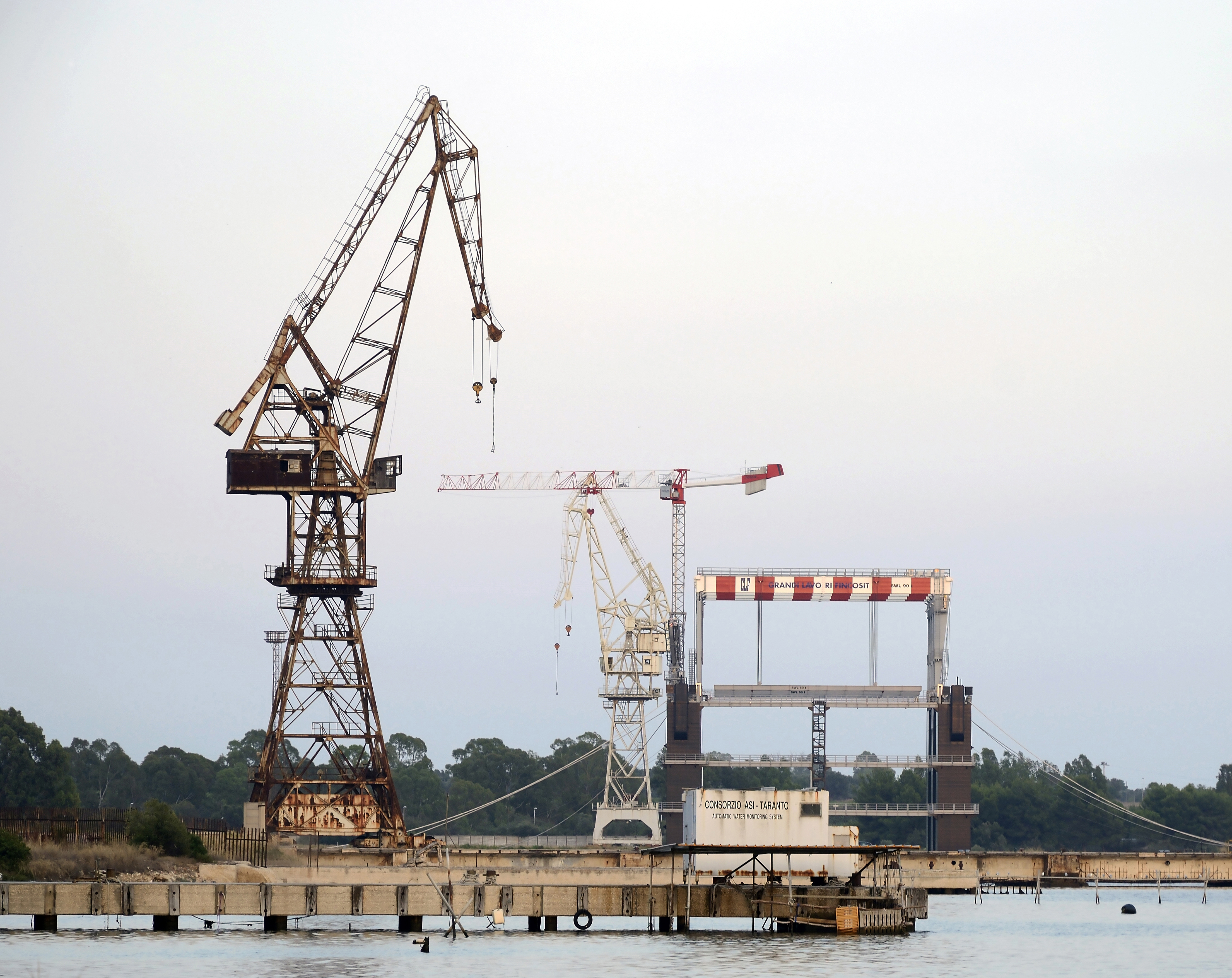 Old cranes abandoned at the port of Taranto