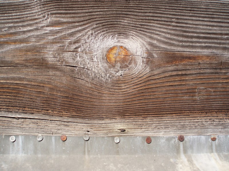 Wooden-plank-and-nailed-alum-sheet