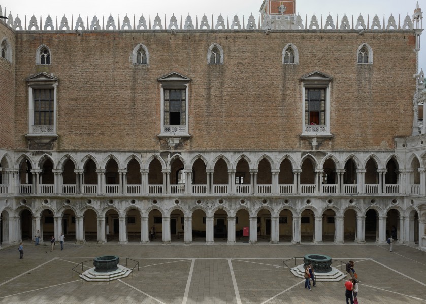 Bronze wells and Western face courtyard of Doges palace Venice