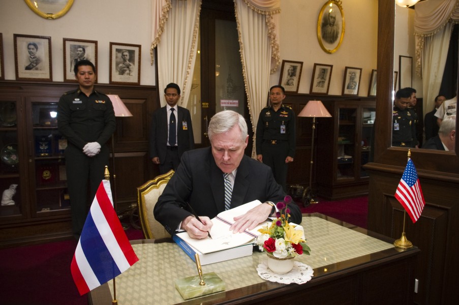 US Navy 101122-N-5549O-075 Secretary of the Navy (SECNAV) the Honorable Ray Mabus signs the guest book while meeting with Thailand's Minister of De