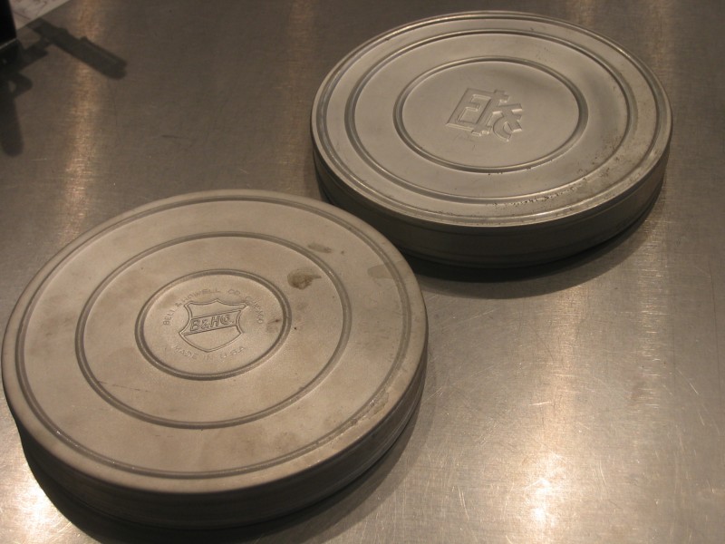 Ektachrome- and Bell & Howell-brand film reel canisters