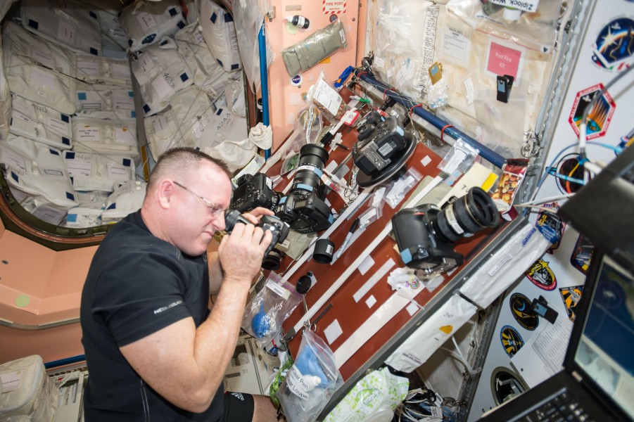 ISS-42 Barry Wilmore inspects the cameras in the Unity module