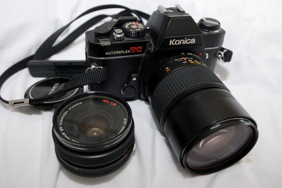 Konica Autoreflex TC 135 film SLR camera with Hexanon AR 135mm F3.5 lens mounted and a Hexanon AR 40mm F1.8 lens next to it