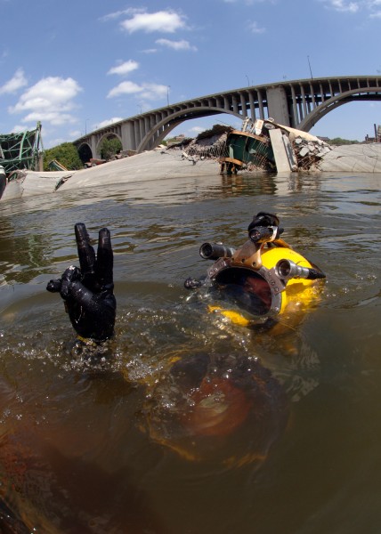 US Navy 070811-N-3093M-004 Navy Diver 1st Class Joshua Harsh attached to Mobile Diving and Salvage Unit (MDSU) 2 from Naval Amphibious Base Little Creek, Va., prepares to leave the surface on a salvage dive in the Mississippi R