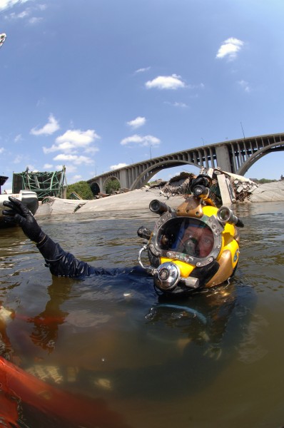 US Navy 070811-N-3093M-007 Navy Diver 1st Class Joshua Harsh attached to Mobile Diving and Salvage Unit (MDSU) 2 from Naval Amphibious Base Little Creek, Va., prepares to leave the surface on a salvage dive in the Mississippi R