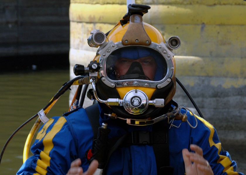 US Navy 070811-N-3093M-017 Chief Navy Diver Scott Maynard attached to Mobile Diving and Salvage Unit (MDSU) 2, readies for a dive into the Mississippi river in support of ongoing search and recovery operations in Minneapolis