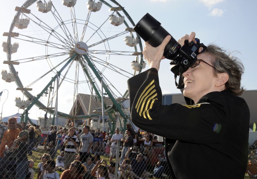 US Navy 110319-N-5366T-018 Senior Chief Mass Communication Specialist Leslie Shively photographs members of the U.S. Navy parachute demonstration t