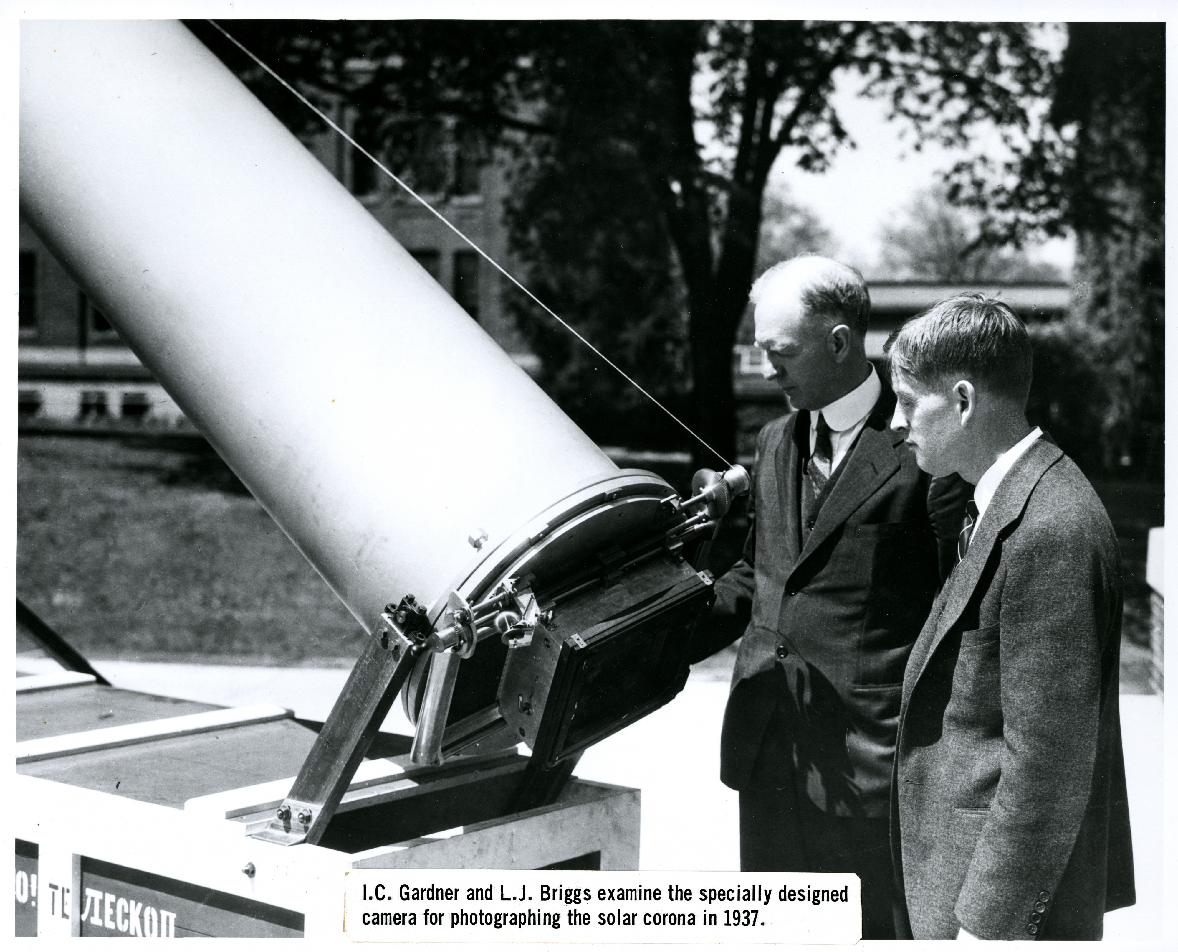 I. C. Gardner and L. J. Briggs examine the specially designed camera for photographing the solar corona in 1937