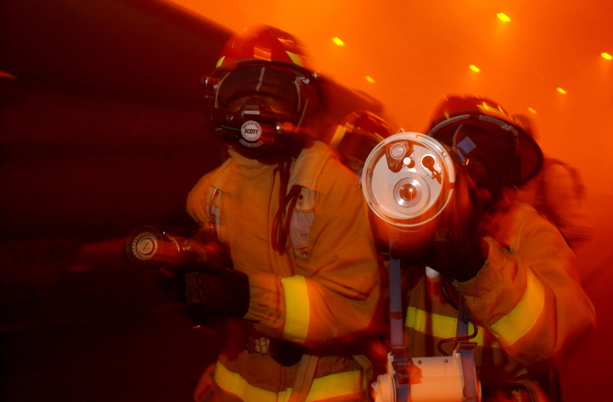 US Navy 040419-N-9851B-076 A fire team uses a Naval Firefighter Thermal Imager (NFTI) while advancing on a simulated fire