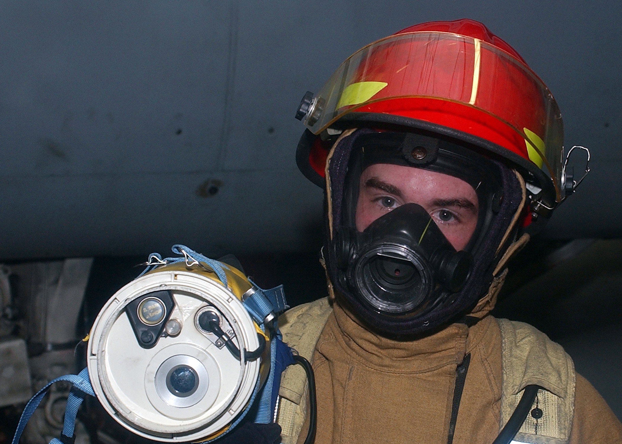 US Navy 041115-N-6125G-006 Fireman Brandon Dossey uses a Naval Firefighters Thermal Imaging (NFTI) system during a fire drill aboard the Nimitz-class aircraft carrier USS Harry S. Truman (CVN 75)
