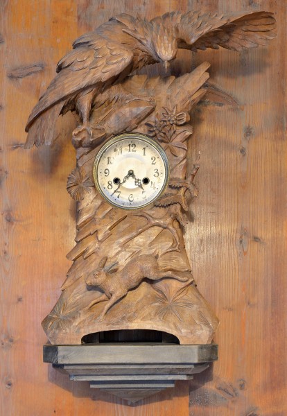Clockstand with eagle and hare woodcarved Brienz