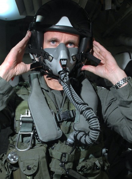 US Navy 050623-N-1332Y-128 Commander, U.S. Seventh Fleet, Vice Adm. Jonathan W. Greenert, dons an oxygen mask and pilot's helmet as he prepares for a flight in an F-A-18F Super Hornet