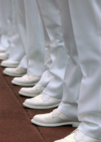 US Navy 100406-N-5528G-005 U.S. Naval Academy Midshipmen stand at parade rest during a brigade summer whites uniform inspection