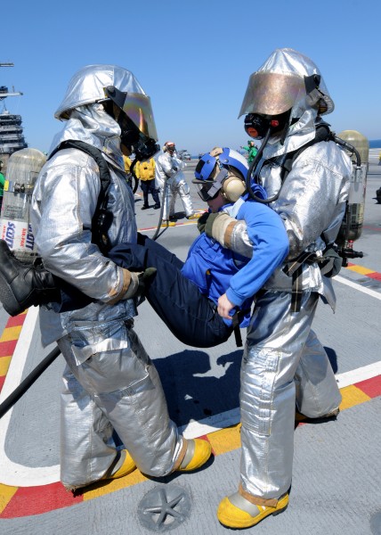 US Navy 100829-N-2686K-062 Sailors assigned to the air department crash and salvage division aboard the aircraft carrier USS George H.W. Bush (CVN 77) simulate an extraction of a Sailor