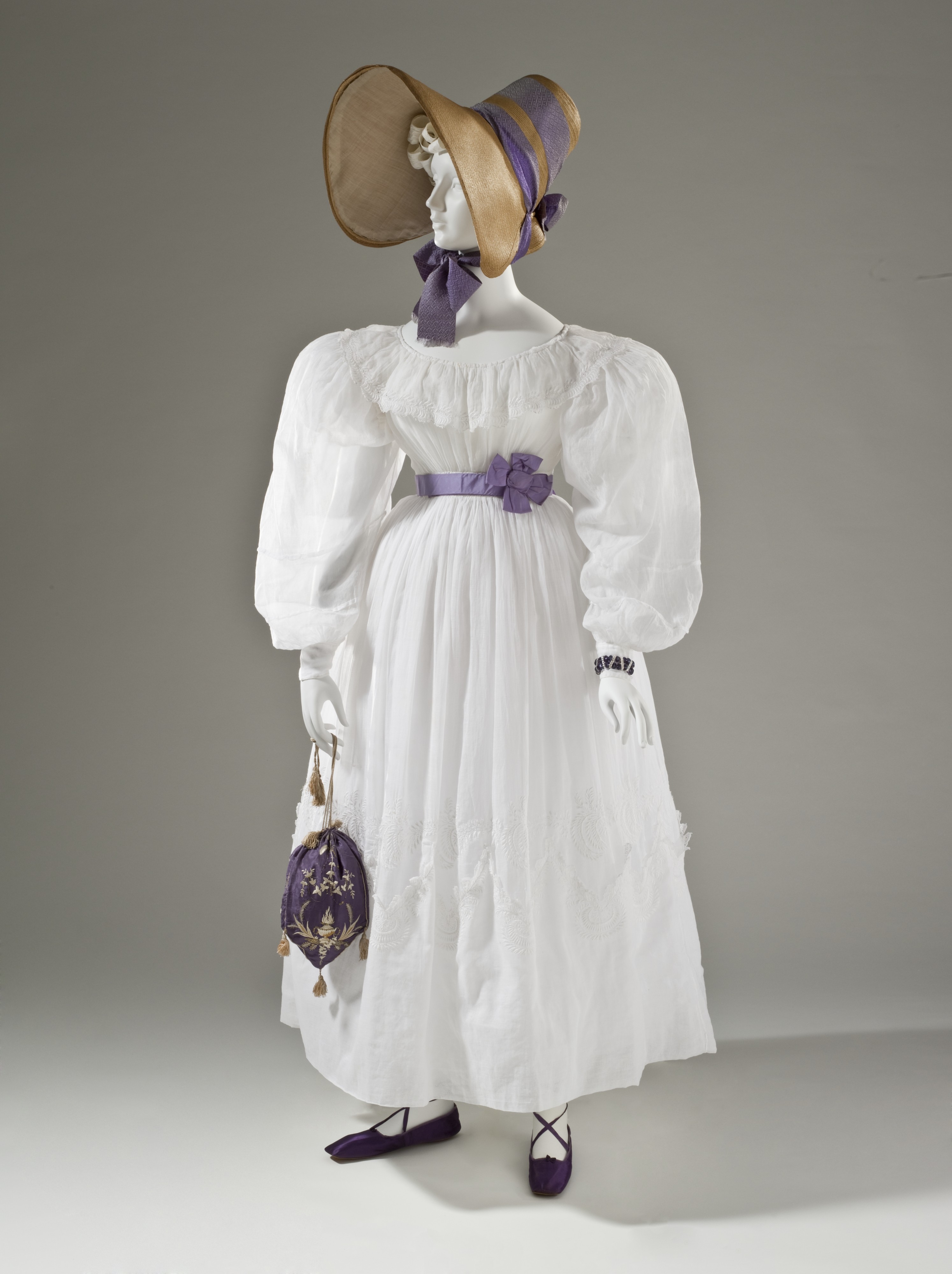 Woman's muslin dress and straw bonnet c. 1830