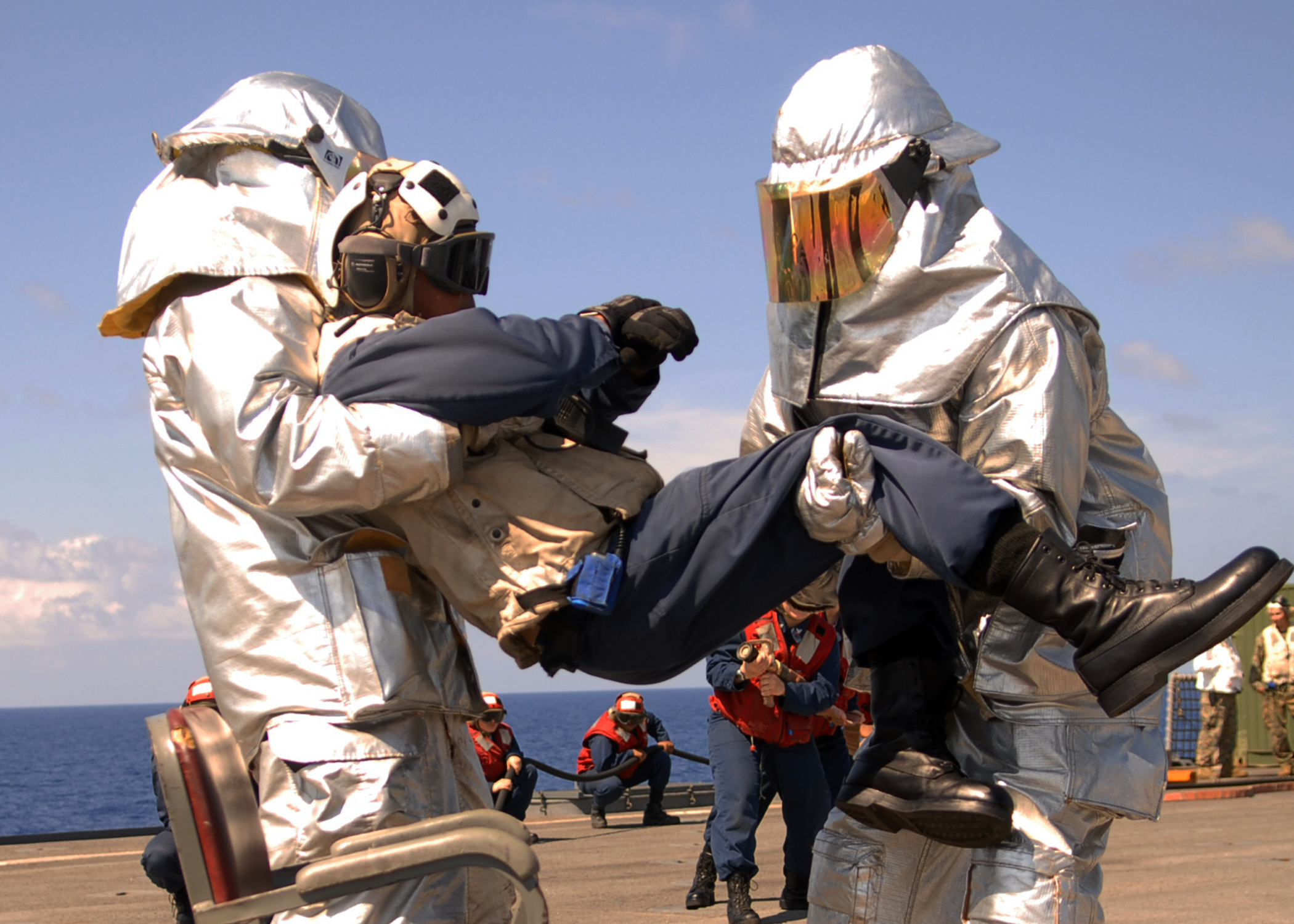 US Navy 100301-N-6692A-013 Sailors participate in a crash and smash drill aboard the amphibious dock landing ship USS Harpers Ferry (LSD 49)