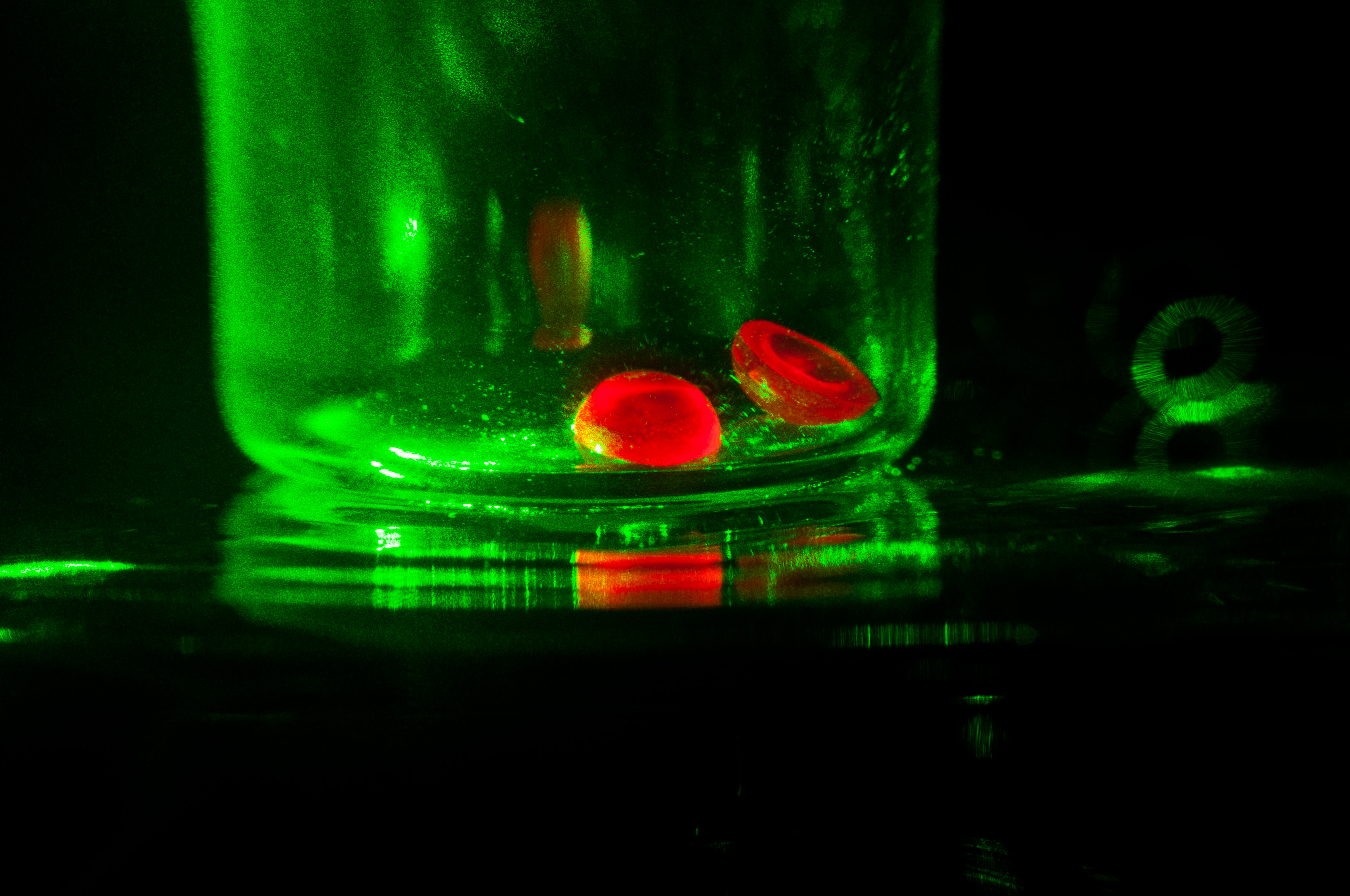 Artificial ruby hemisphere under a monochromatic light
