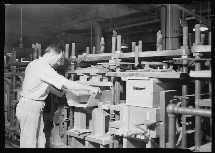 Camden, New Jersey - Cabinet making. RCA Victor. Cabinet assembler - assembling waist (front and ends of cabinet).... - NARA - 518696