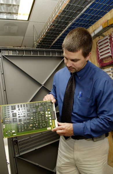 Technician checks circuit card