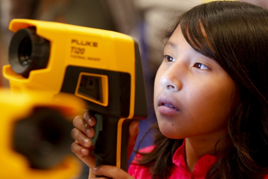 US Navy 101013-N-8863V-460 A fourth grade student from Arlanza Elementary School looks through a Navy thermal imager during the 11th annual Science
