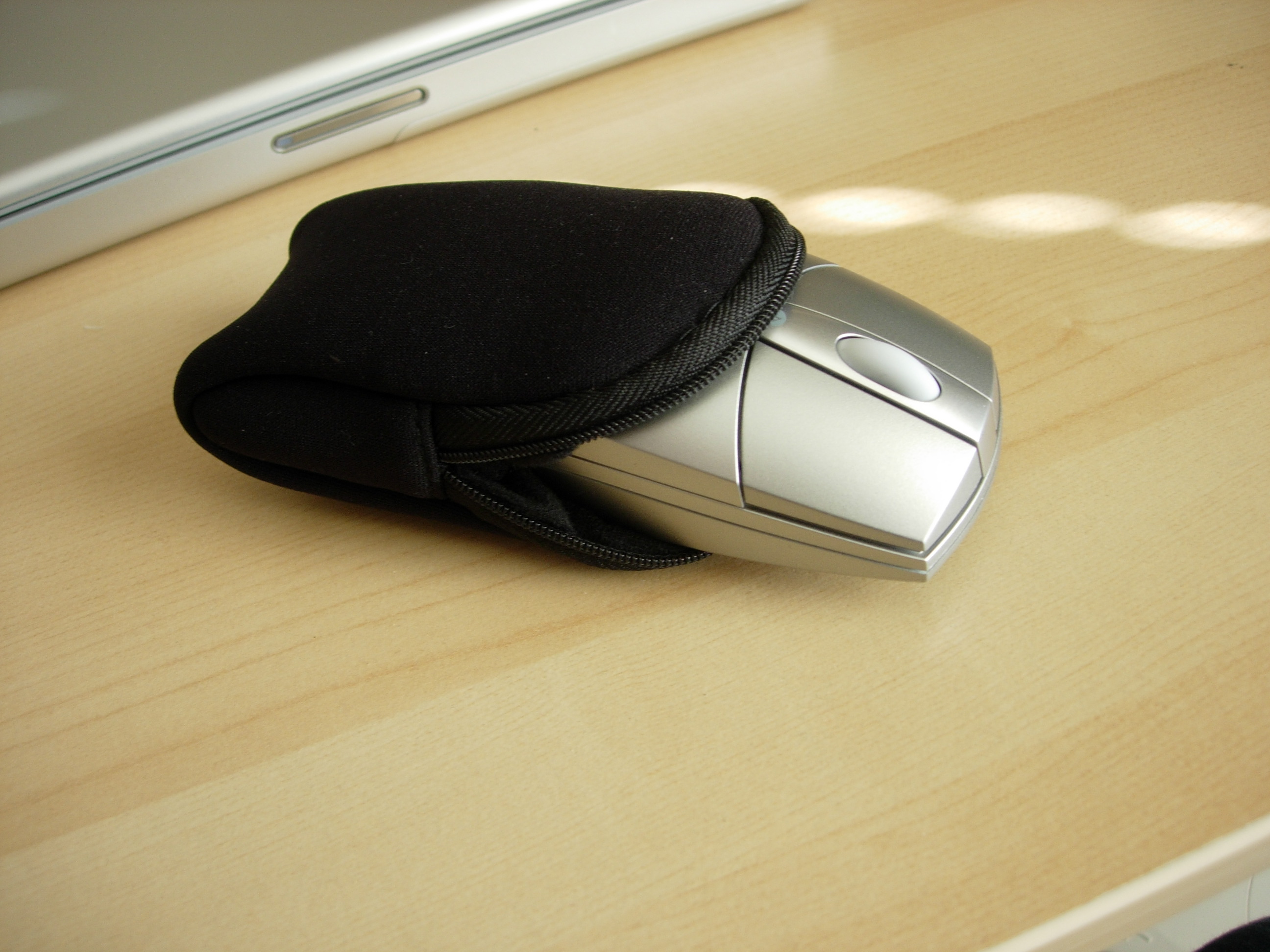 Silver computer mouse with neoprene case