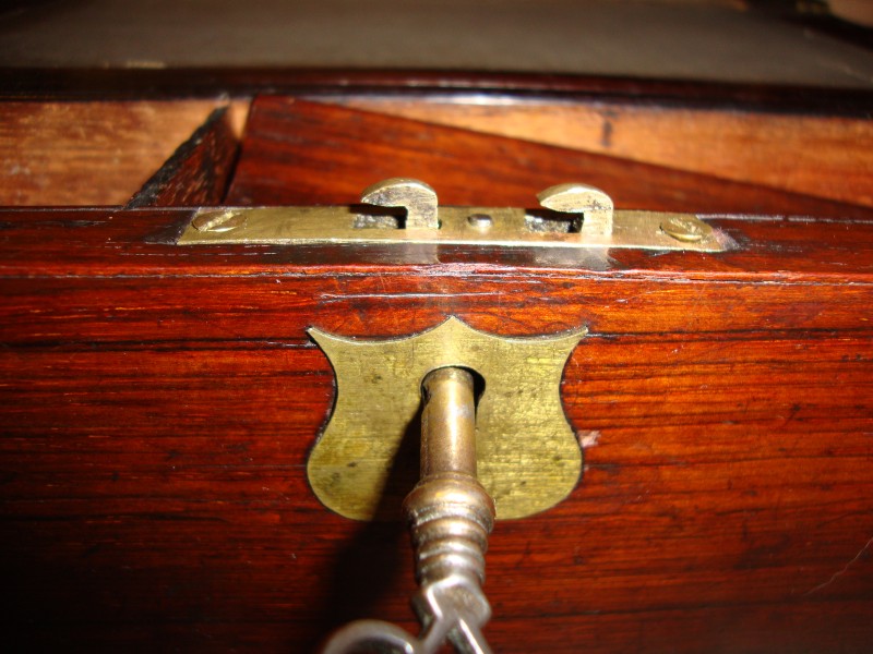 Detail of lock on antique wooden lap desk