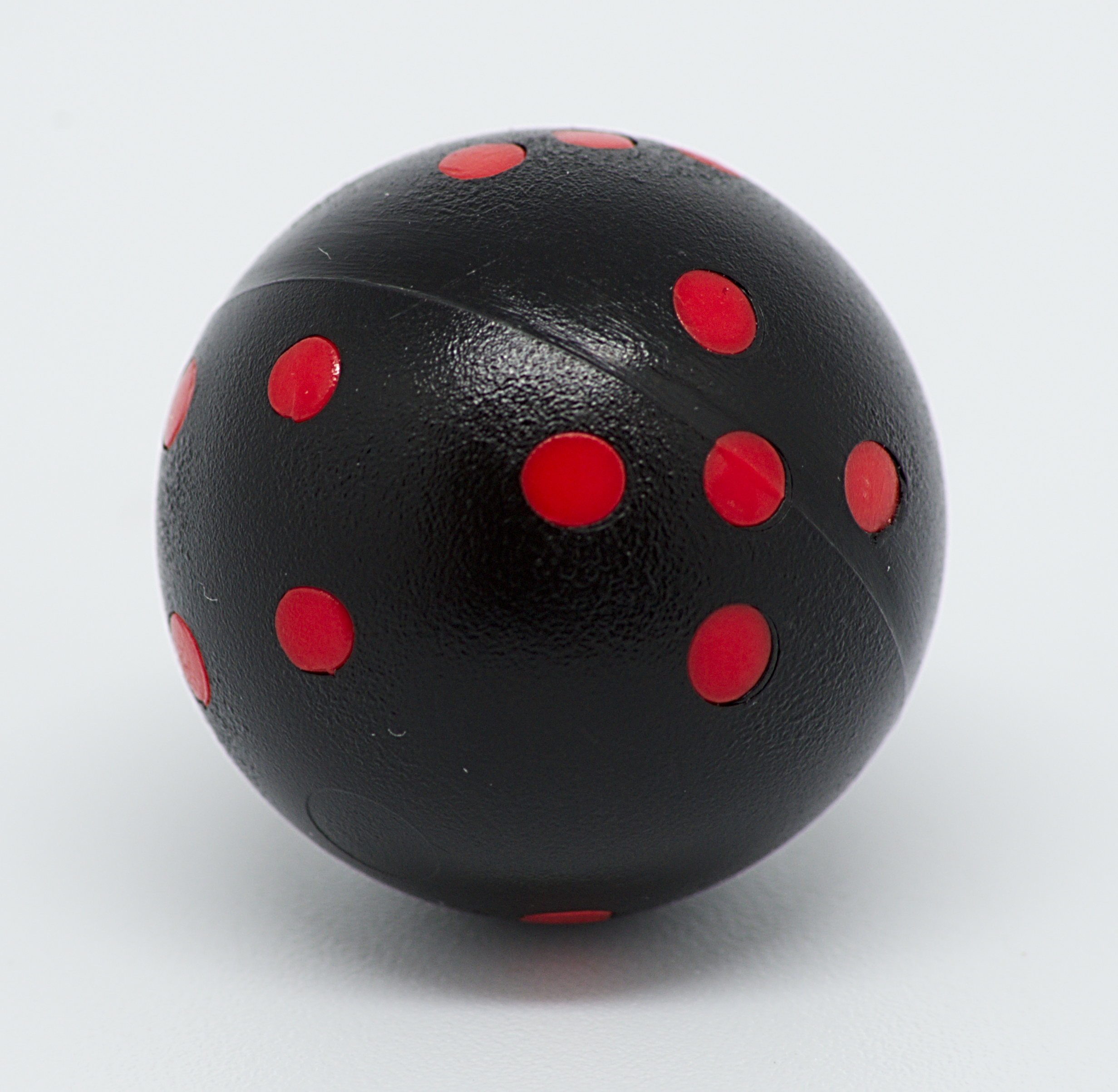 Black and red round 6-sided die