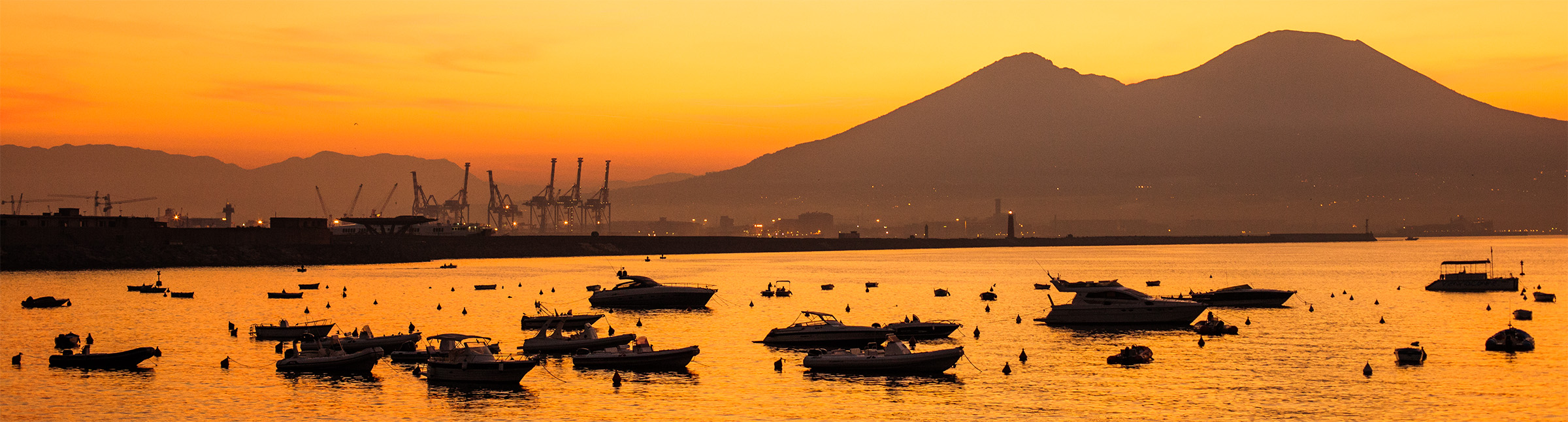 Boats and Mount Vesuvius at sunrise (8204145887)