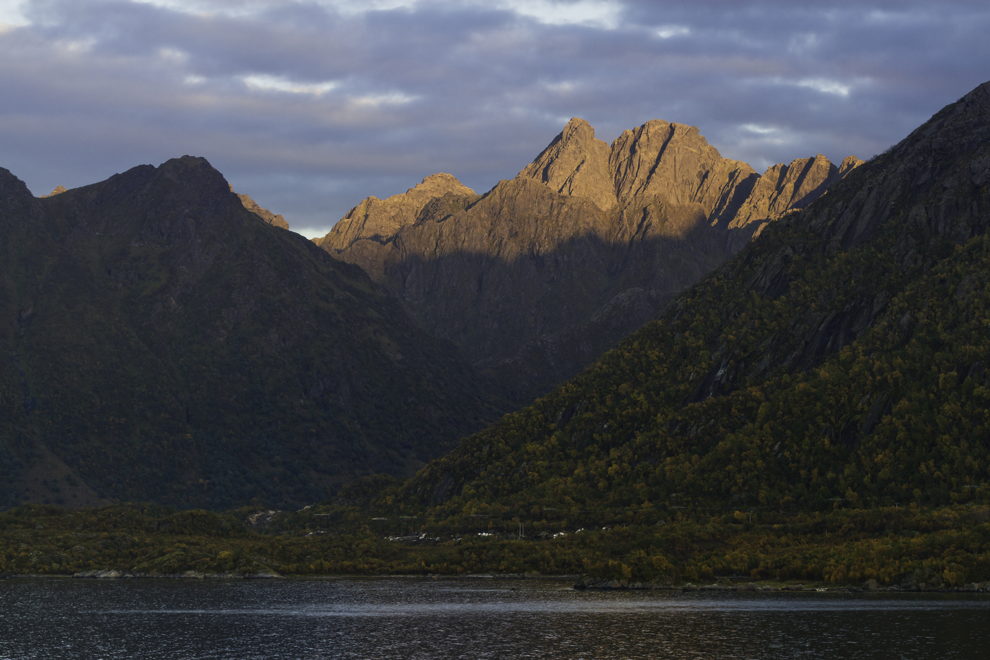 Olsanestinden and Vassdalstindan in evening light from Holdøya, Nordland, Norway, 2015 September