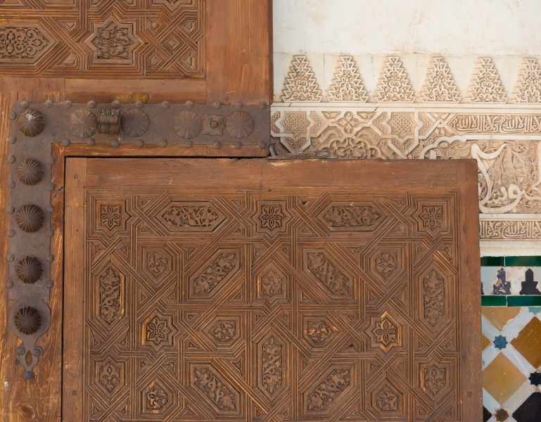Stucco, wooden door, mosaics, wall Alhambra, Granada, Spain