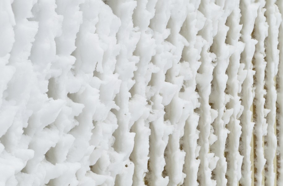 Windblown snow on a wall