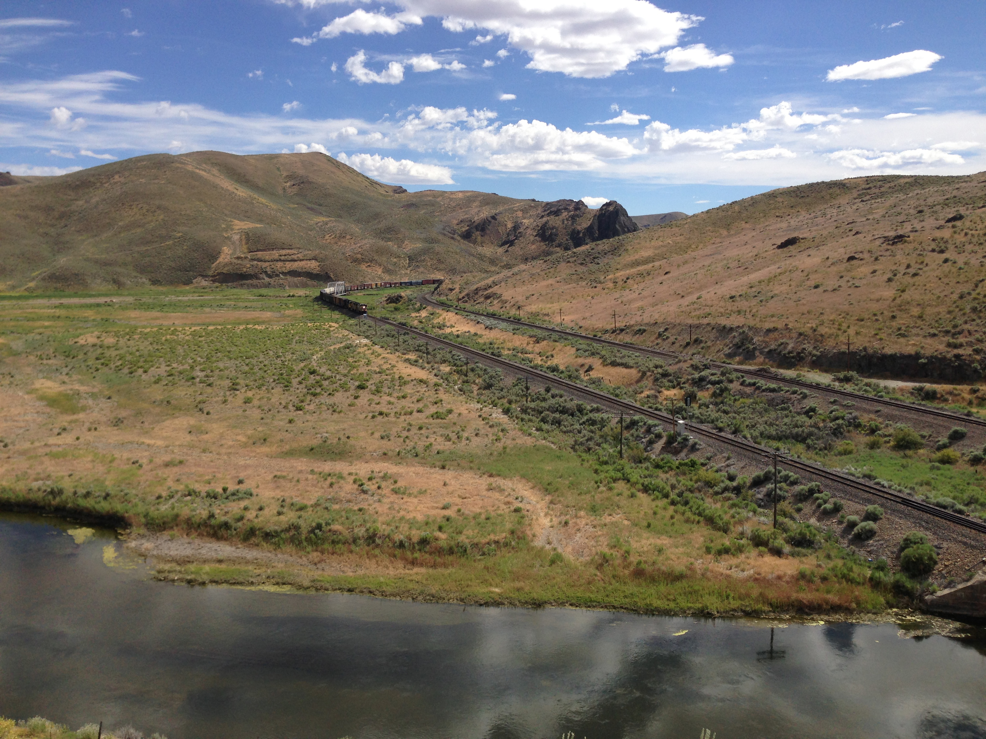 2014-06-21 15 46 41 Train approaching a railway bridge over the Humboldt River in Palisade, Nevada