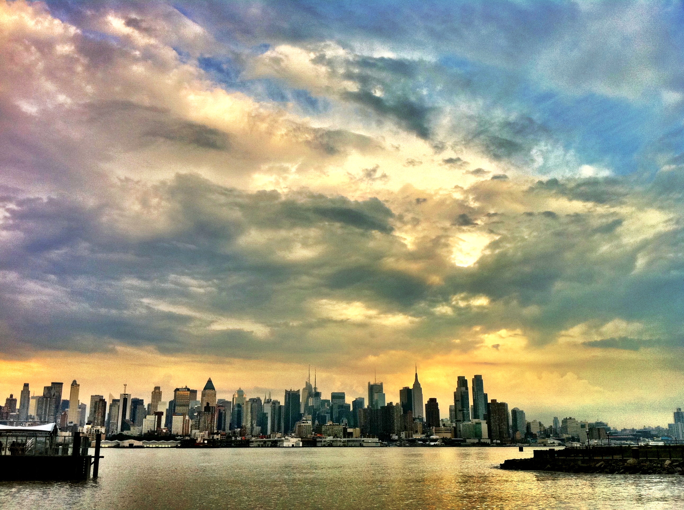 The New York City skyline after a stormy afternoon from Port Imperial, NY Waterway in Weehawken New Jersey