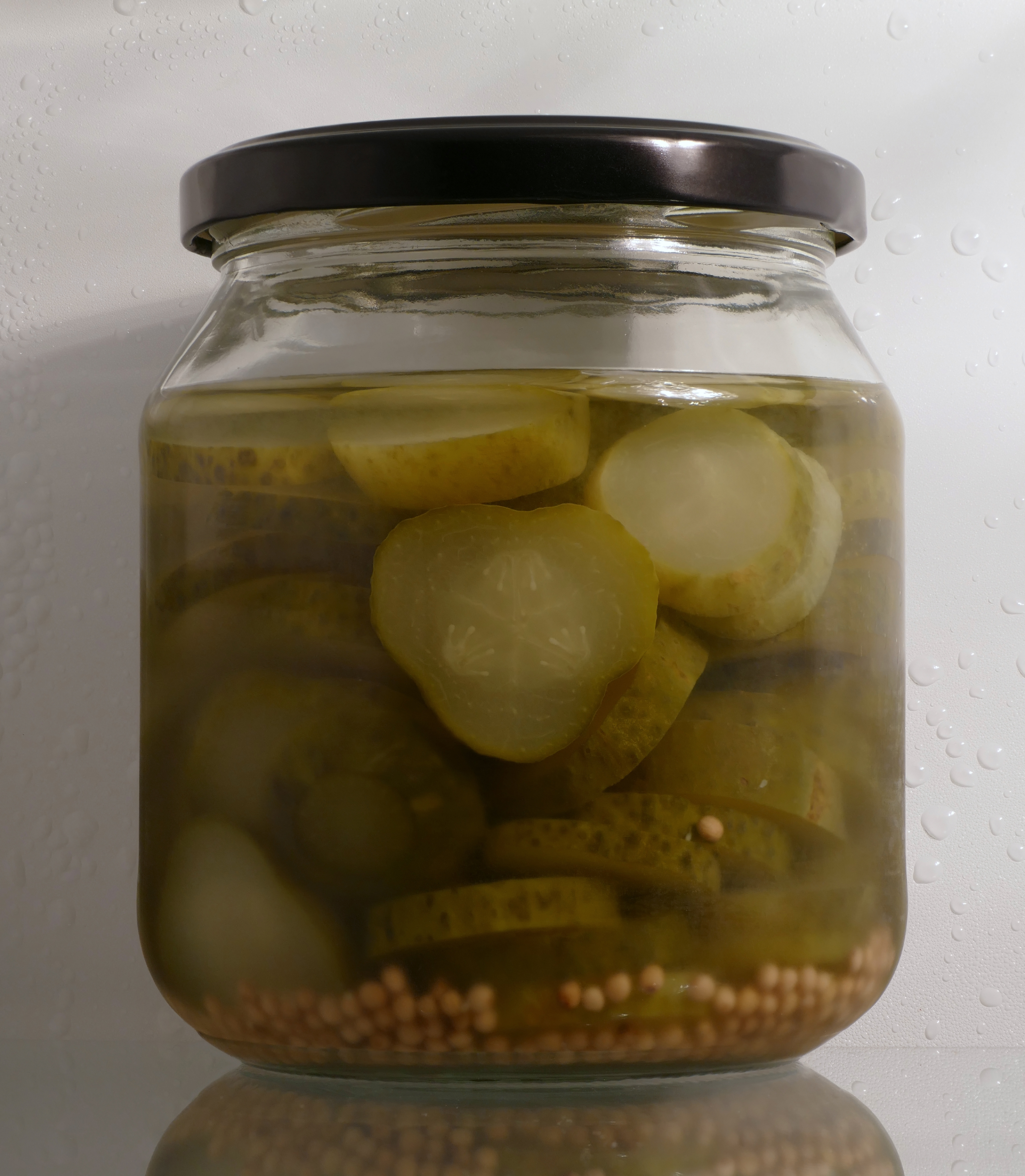 A jar of sliced pickled cucumber