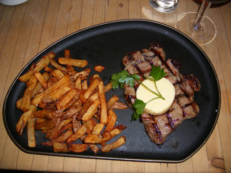 Sirloin steak with garlic butter and french fries