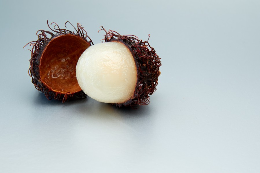Rambutan fruit, half peeled