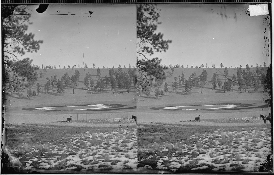 MAN SHOOTING NEXT TO POND CRATER IN SAN FRANCISCO MOUNTAINS, ARIZONA - NARA - 523898