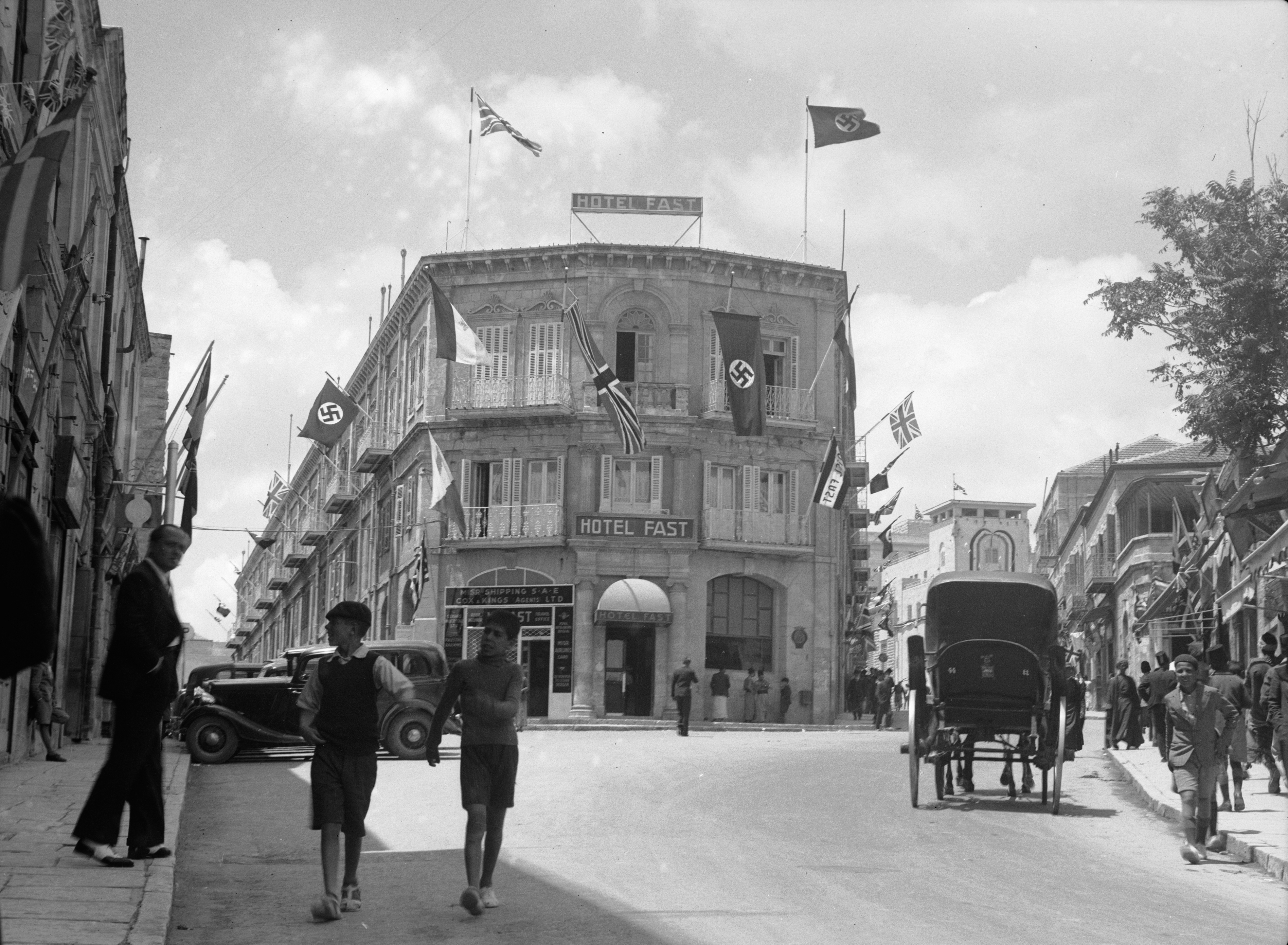 British and Nazi flags flying from the Fast Hotel. matpc.16994
