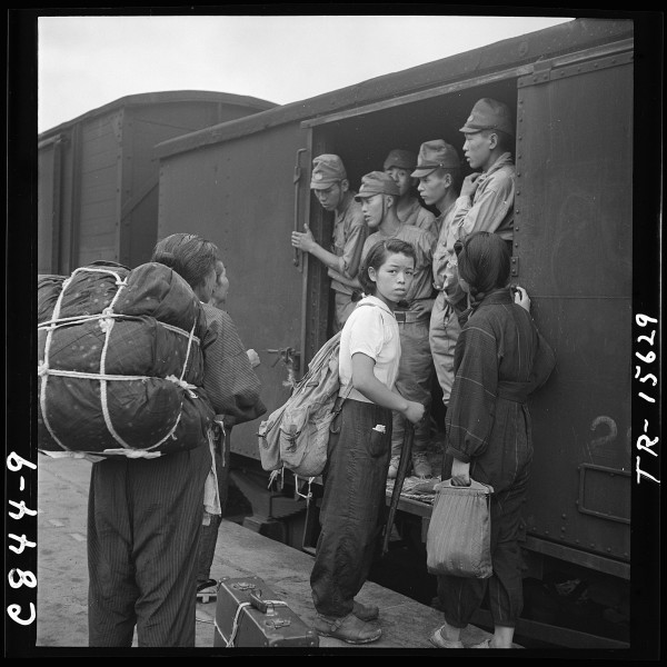 Demobilized Japanese soldiers crowd trains at Hiroshima on way to homes. - NARA - 520935