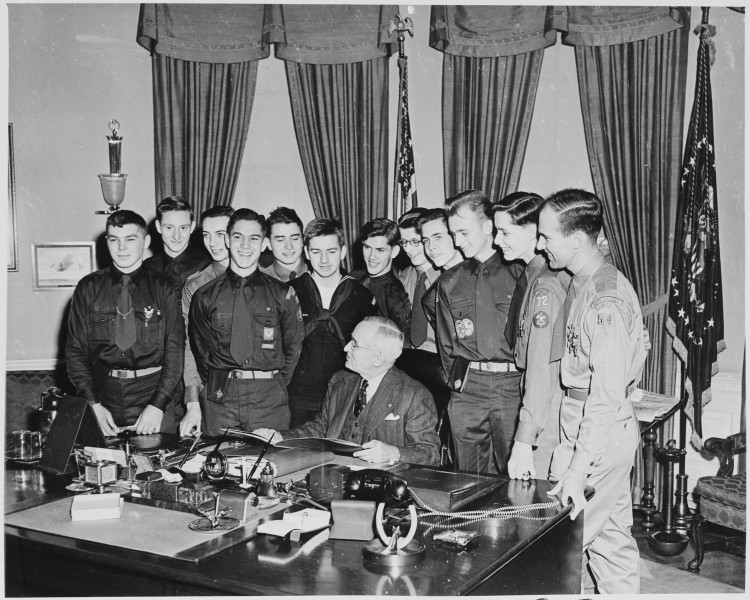 Photograph of President Truman with a group of twelve Boy Scouts who have achieved the status of Eagle Scout, in the... - NARA - 200184