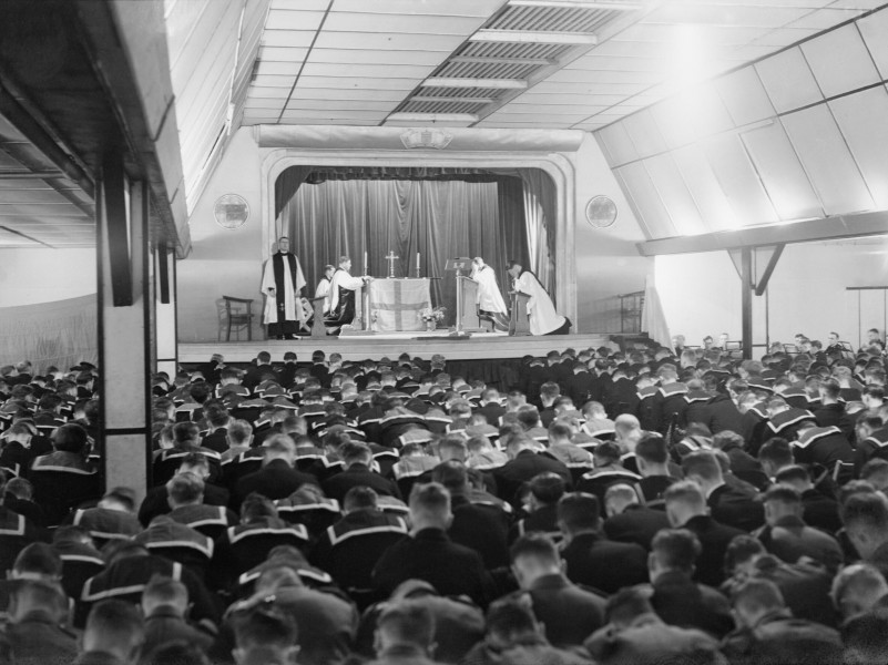 The Archbishop of Canterbury conducts a service in the cinema at Flotta on Orkney during his visit to the Home Fleet at Scapa Flow, 6 September 1942. A11549