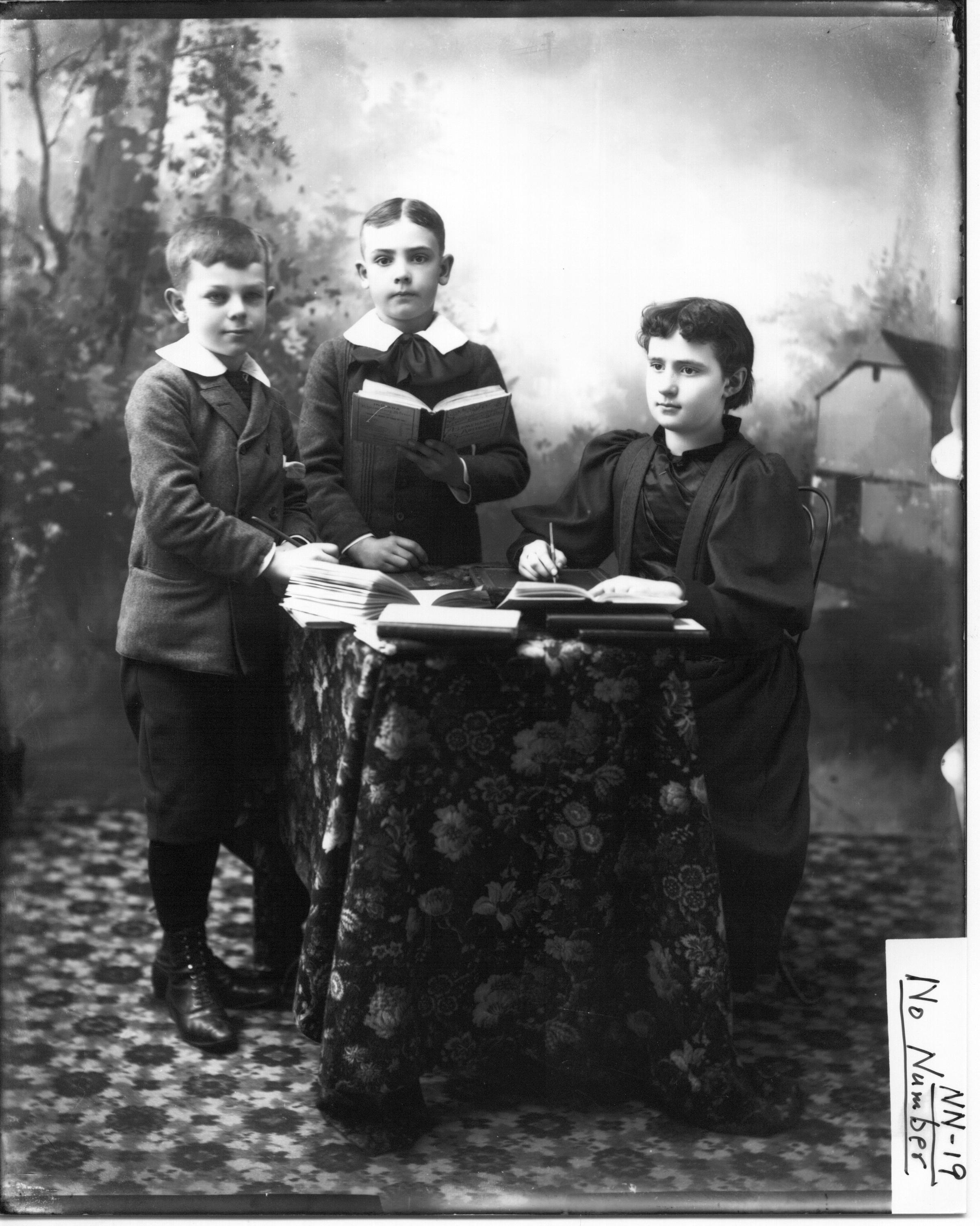 Children around a table with books n.d. (3191498979)