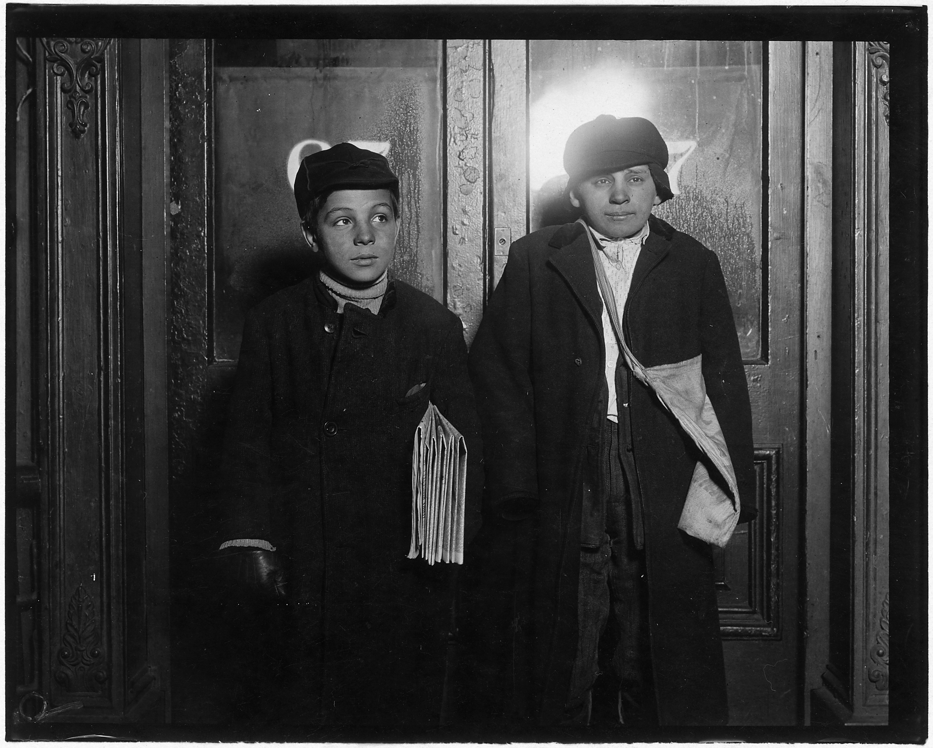 In a saloon doorway at 8-30 P.M. Left to right, George Cappello, 12 years old. Frank Laporter, 13 years old. Utica, N.Y. - NARA - 523278