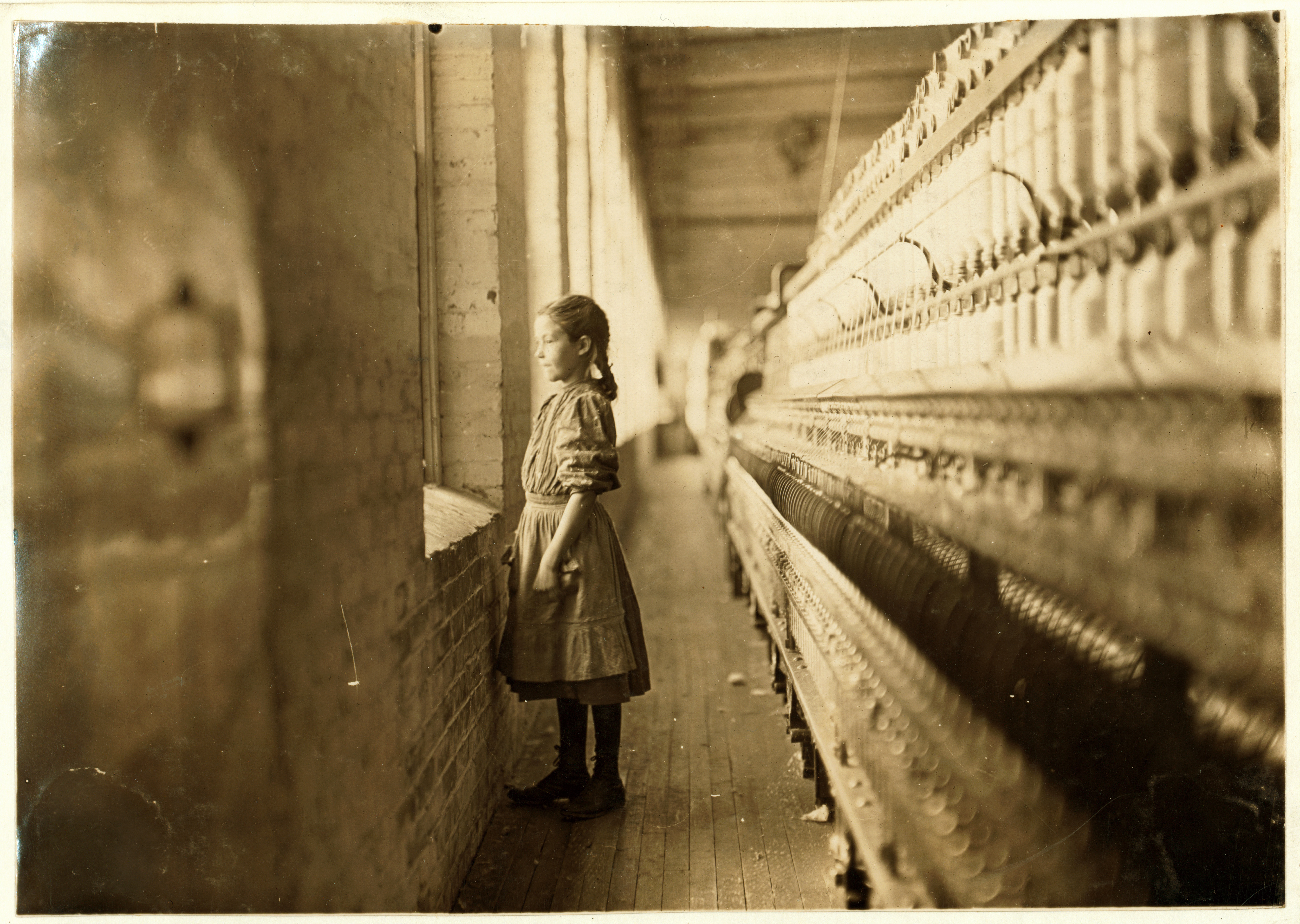 Lewis Hine- Girl spinner, 11 years old, Rhodes Manufacturing Co., Lincolnton, North Carolina, 1908 (5631048712)