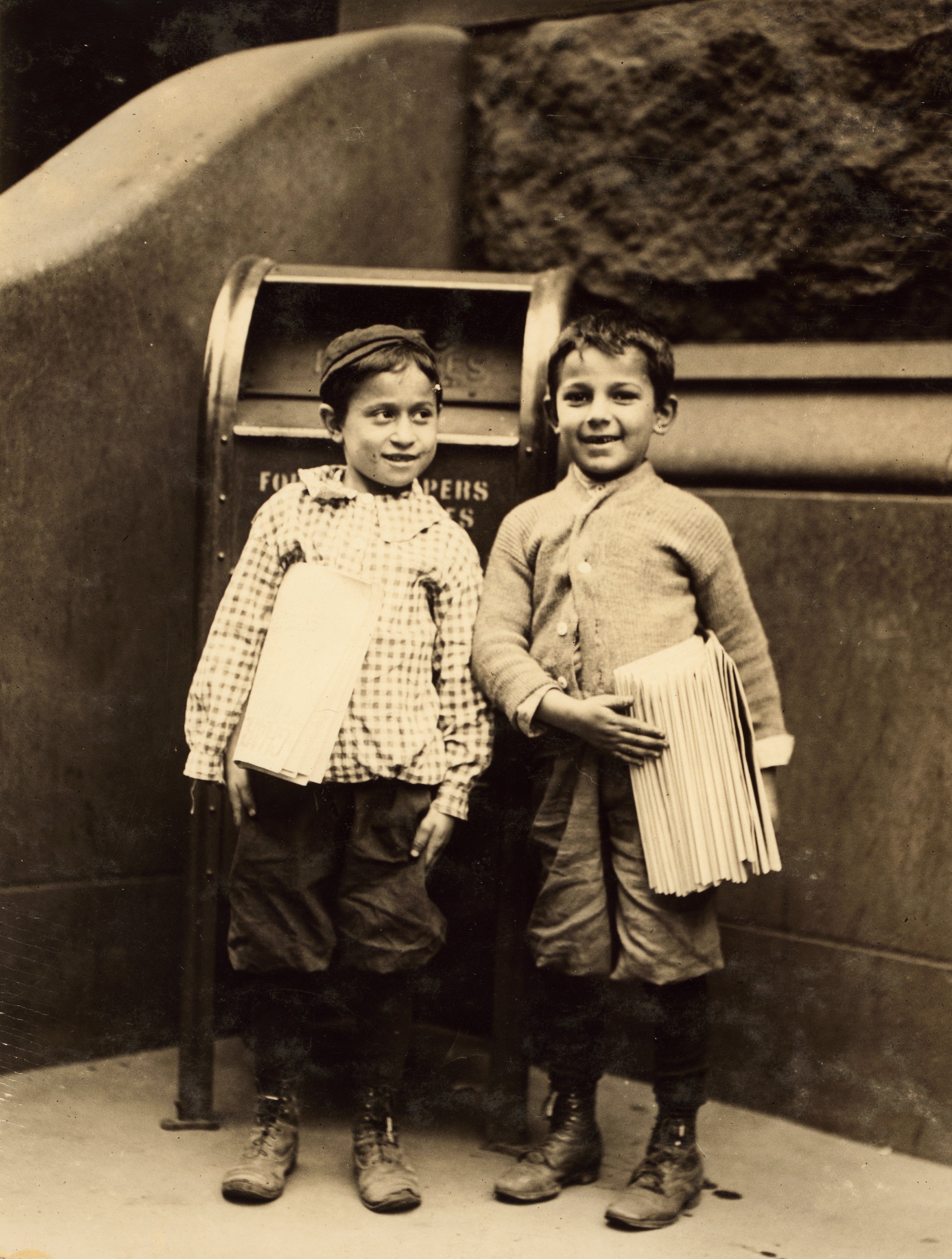 Lewis Hine, Willie Cohen and Max Rafalovizht, 8 years of age, newsboys, Philadelphia, 1910 (cropped)
